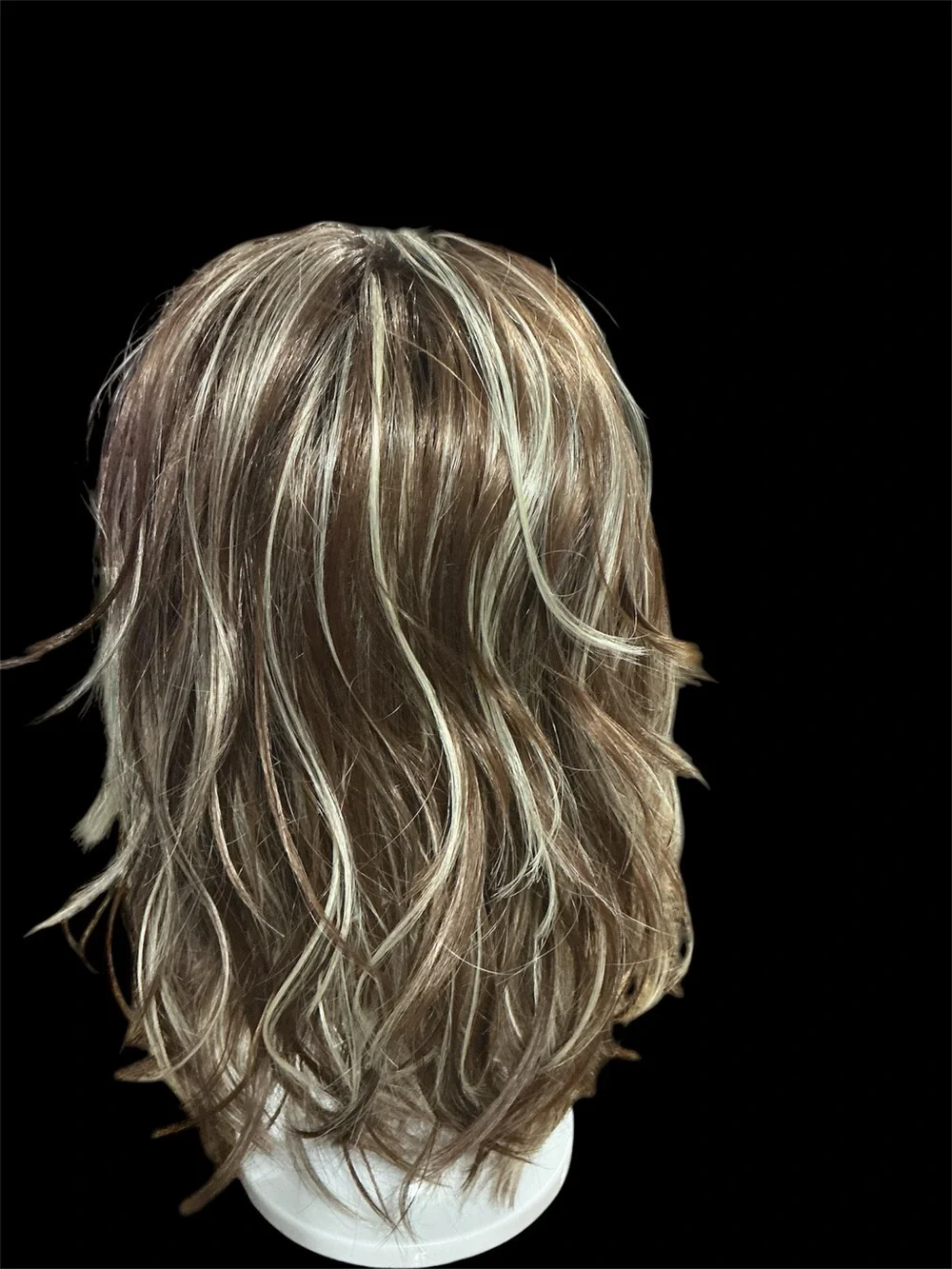 Rene of Paris Natural Layered Women's Wig in Light Brown with Blonde Highlights.